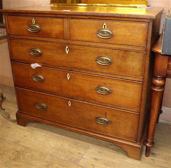 A George III oak chest of five drawers W.101cm